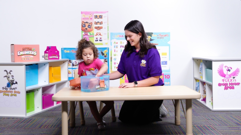 Teacher and child work on STEM project.