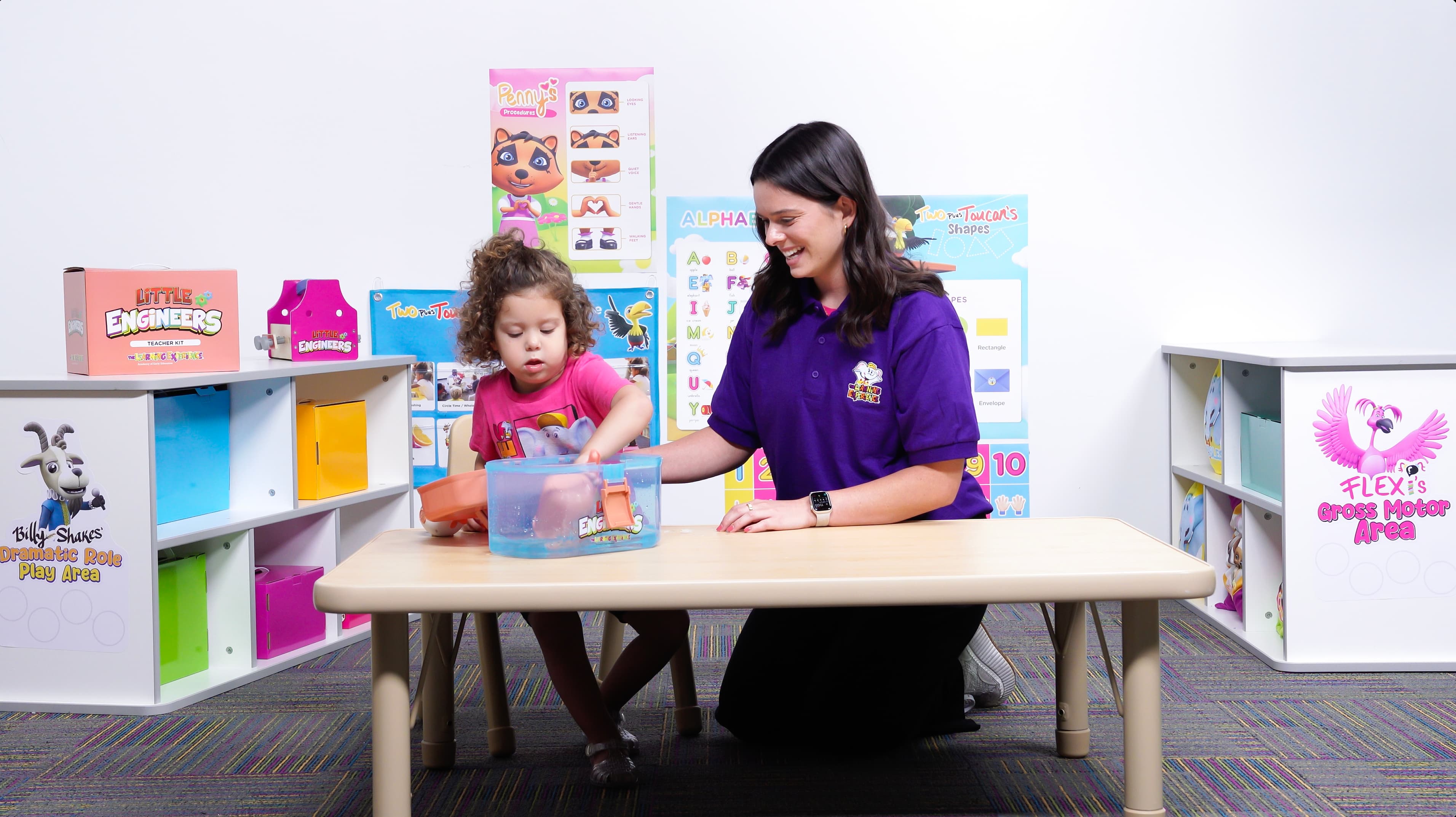 Teacher and child work on STEM project.